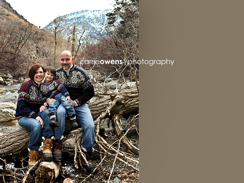 family of three in winter sweaters in the canyons of salt lake city utah