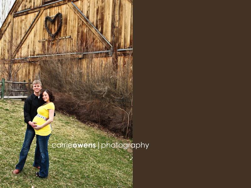 maternity images of couple in front of a barn