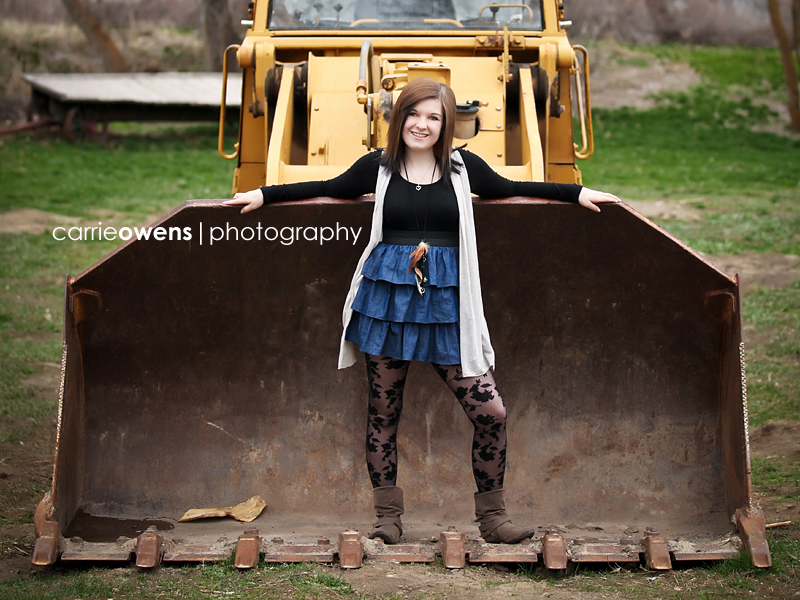 high school senior girl by a bulldozer in salt lake city utah
