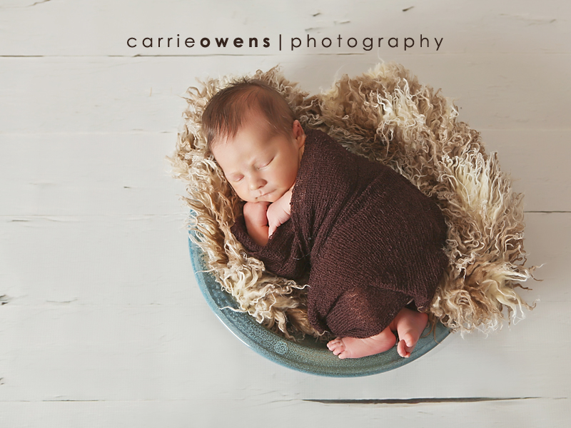 Newborn Photography in Salt Lake City Utah of baby in handmade pottery made by baby's father by newborn photographer Carrie Owens