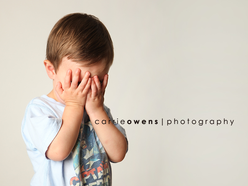 salt lake city utah child photographer Carrie Owens captures young boy as he covers his eyes