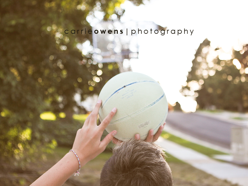 brothers playing basketball in the yard taken by salt lake city utah child photographer Carrie Owens