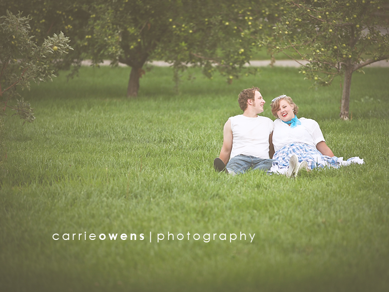 salt lake city utah engagement photographer Carrie Owens captures stylish couple sitting in the grass in 50s themed shoot