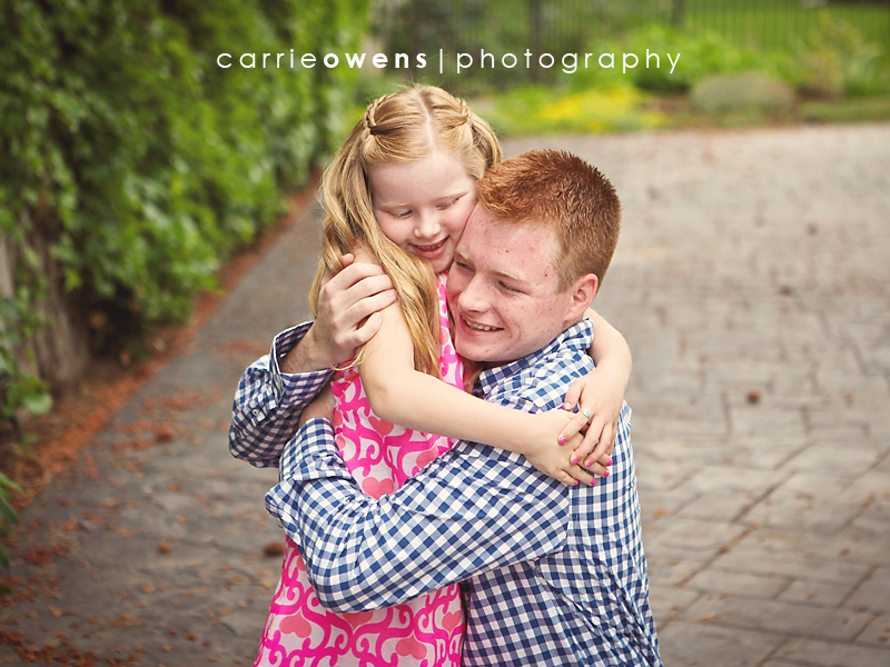 salt lake city utah family photographer Carrie Owens captures family of six outside in the driveway at their sandy utah home