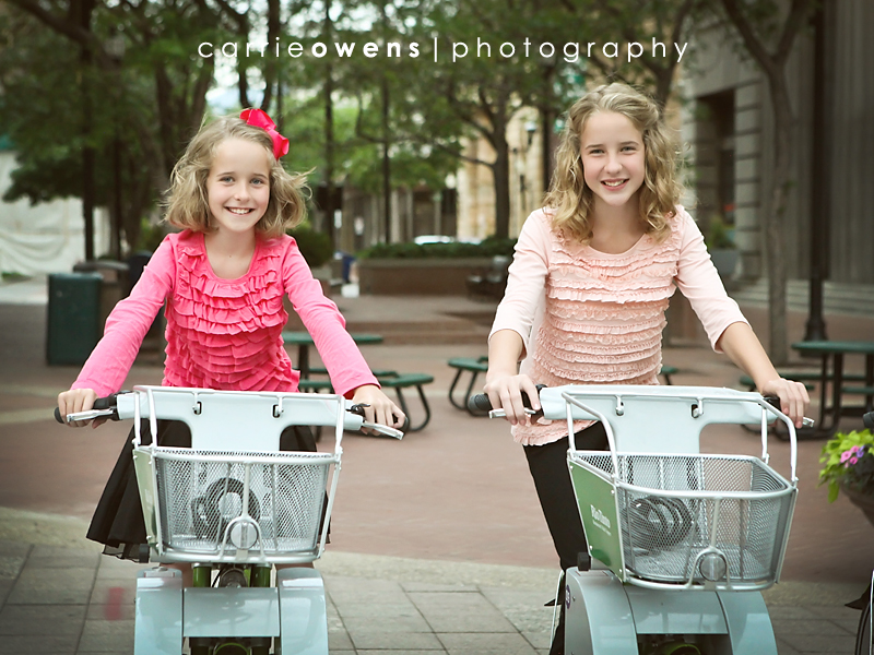 salt lake city utah family photographer Carrie Owens captures family of eight downtown sisters on bikes