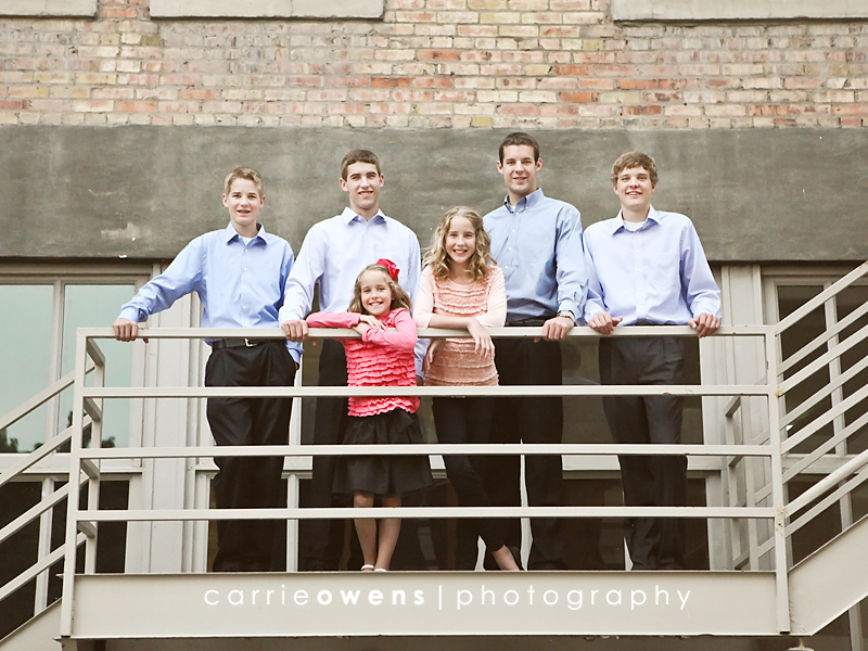 salt lake city utah family photographer Carrie Owens captures family of eight downtown all the kids on the stairs