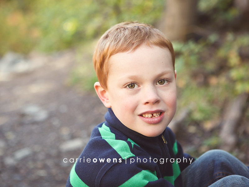 Salt Lake City Utah family photographer youngest brother in the trees