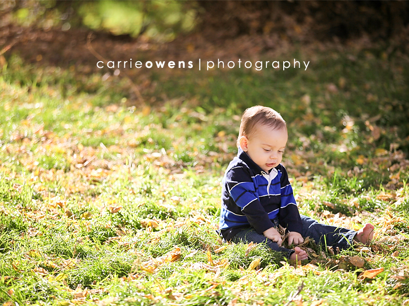 salt lake city child photographer Carrie Owens captures year old boy in the grass