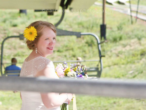 park city resort wedding photographed by carrie owens image of bride getting on the chair lift