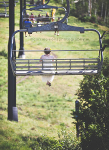park city resort wedding photographed by carrie owens image of bride riding on the chair lift