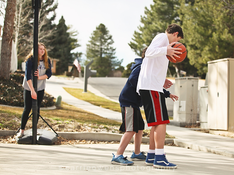 Salt Lake City Utah child and family photographer Carrie Owens photographs her children playing basketball