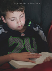 Salt Lake City Utah child photographer Carrie Owens photographs her son reading