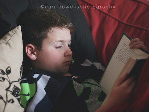 Salt Lake City Utah child photographer Carrie Owens photographs her son reading