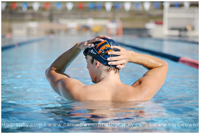 high school senior swimmer at the pool by utah photographer Carrie Owens
