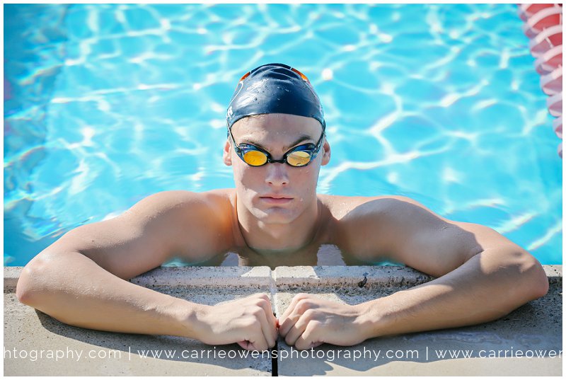 high school senior swimmer at the pool by utah photographer Carrie Owens
