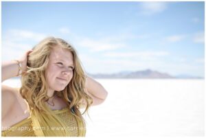 Salt Lake City photographer Carrie Owens photographs Brighton senior girl at the Salt Flats in Utah
