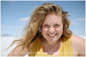 Salt Lake City photographer Carrie Owens photographs Brighton senior girl at the Salt Flats in Utah