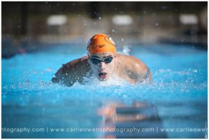 Salt Lake City Utah high school senior photographer Carrie Owens photographs senior swimmer at the pool