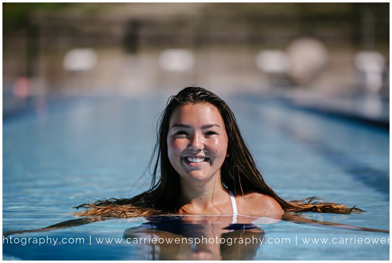 cottonwood heights high school senior photographer Carrie Owens at the pool with senior girl